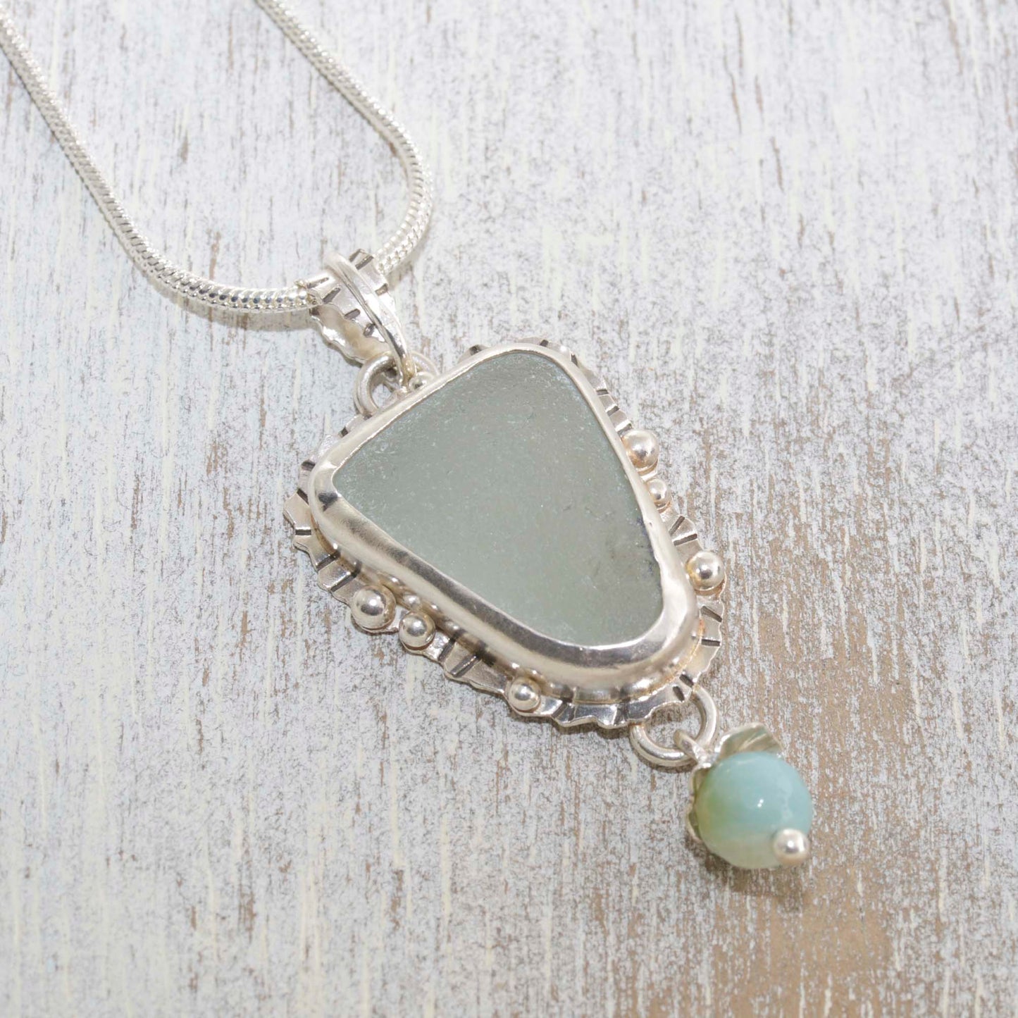 Sea glass pendant necklace hand crafted of tarnish resistant sterling silver accented with an amazonite dangle. (N490)