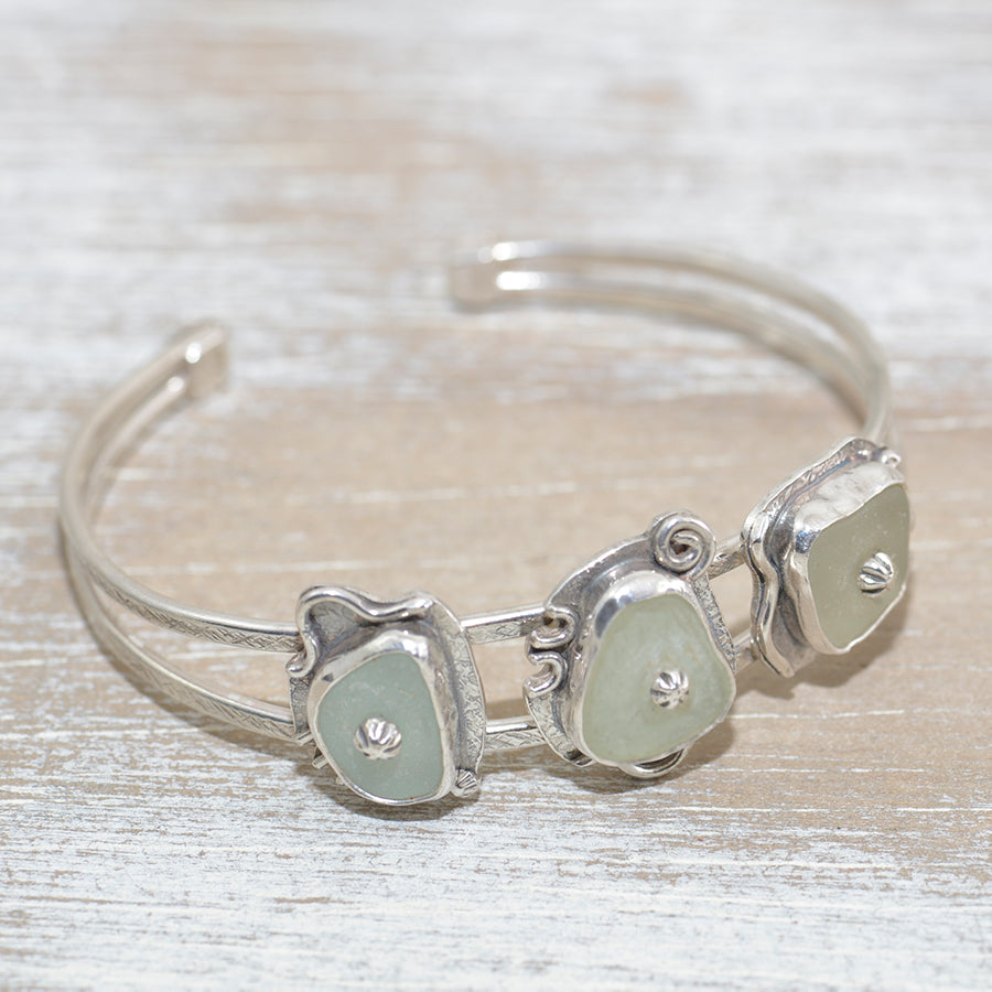 Sea glass cuff bracelet in a hand crafted setting of sterling silver. (B635)
