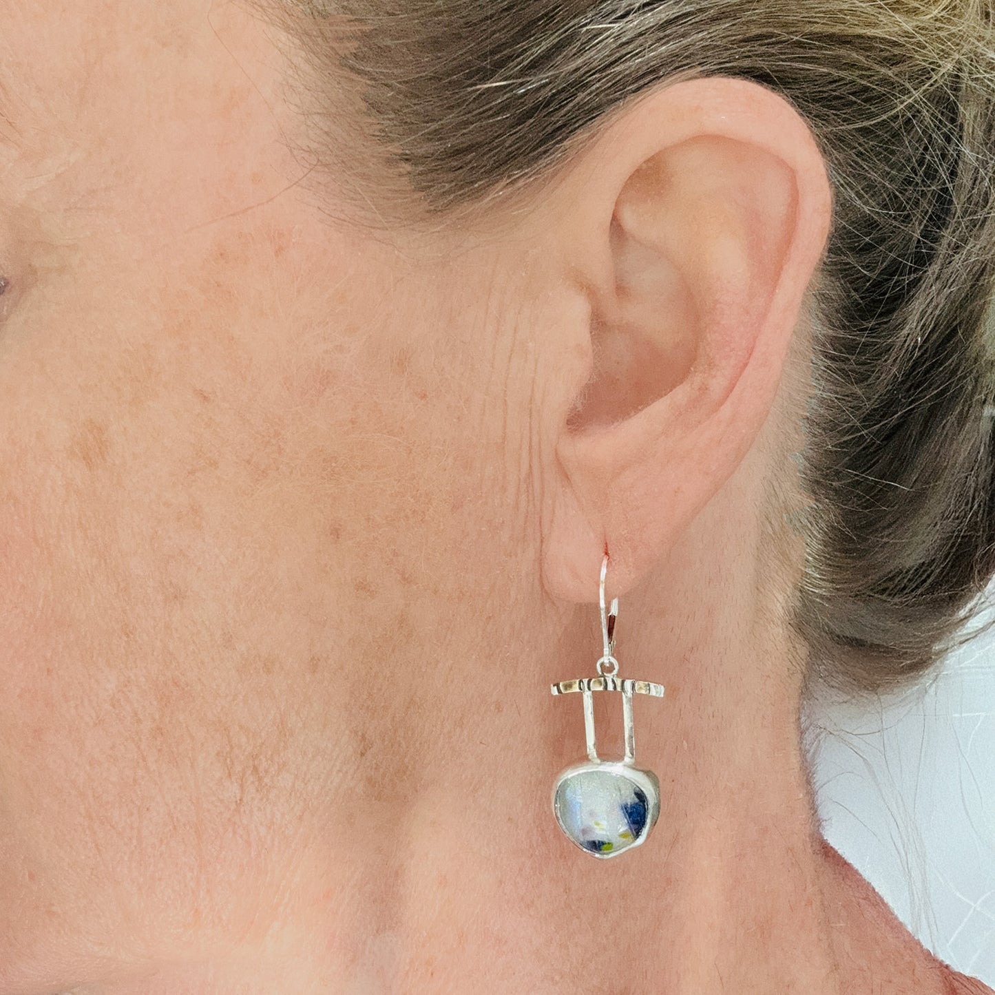 Artistic fused dichroic glass earrings in hand crafted settings of sterling silver accented with gold (E931)