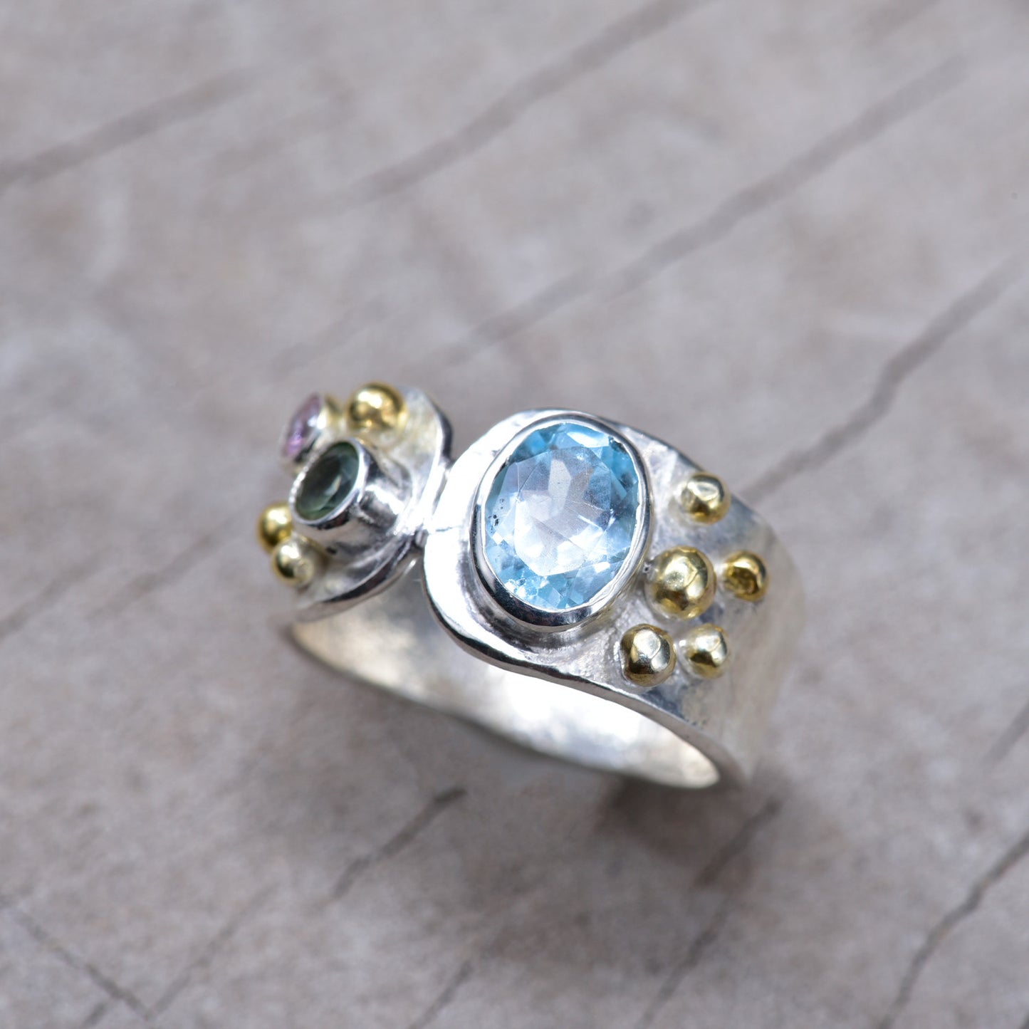 Gemstone ring in a handcrafted sterling silve accented with gold. (R938)