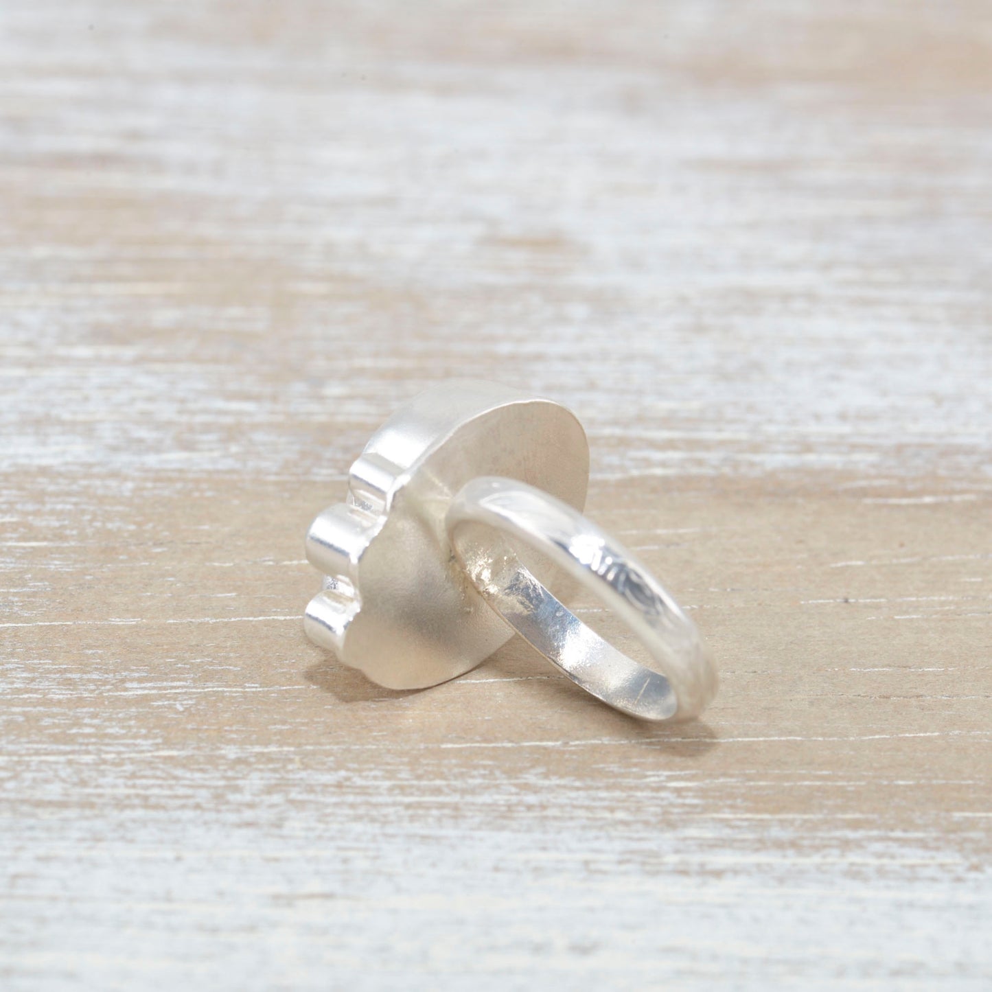 Sea glass ring accented with an aquamarine and sparkly cubic zirconias in sterling silver. (R533)