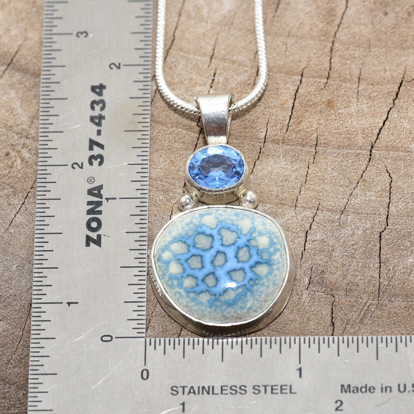 Pendant necklace with hand made enamel cabochon in blue over pale yellow in a hand crafted setting of sterling silver. (N765)