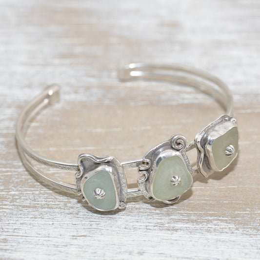 Sea glass cuff bracelet in a hand crafted setting of sterling silver. (B635)