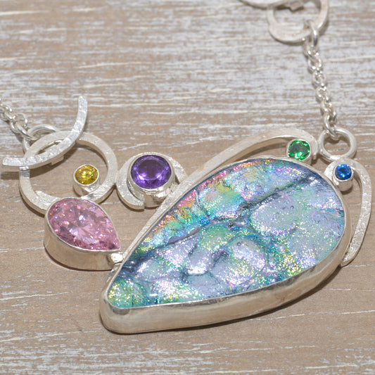 Dichroic glass and gemstone pendant in a hand crafted setting of sterling silver. (N676)