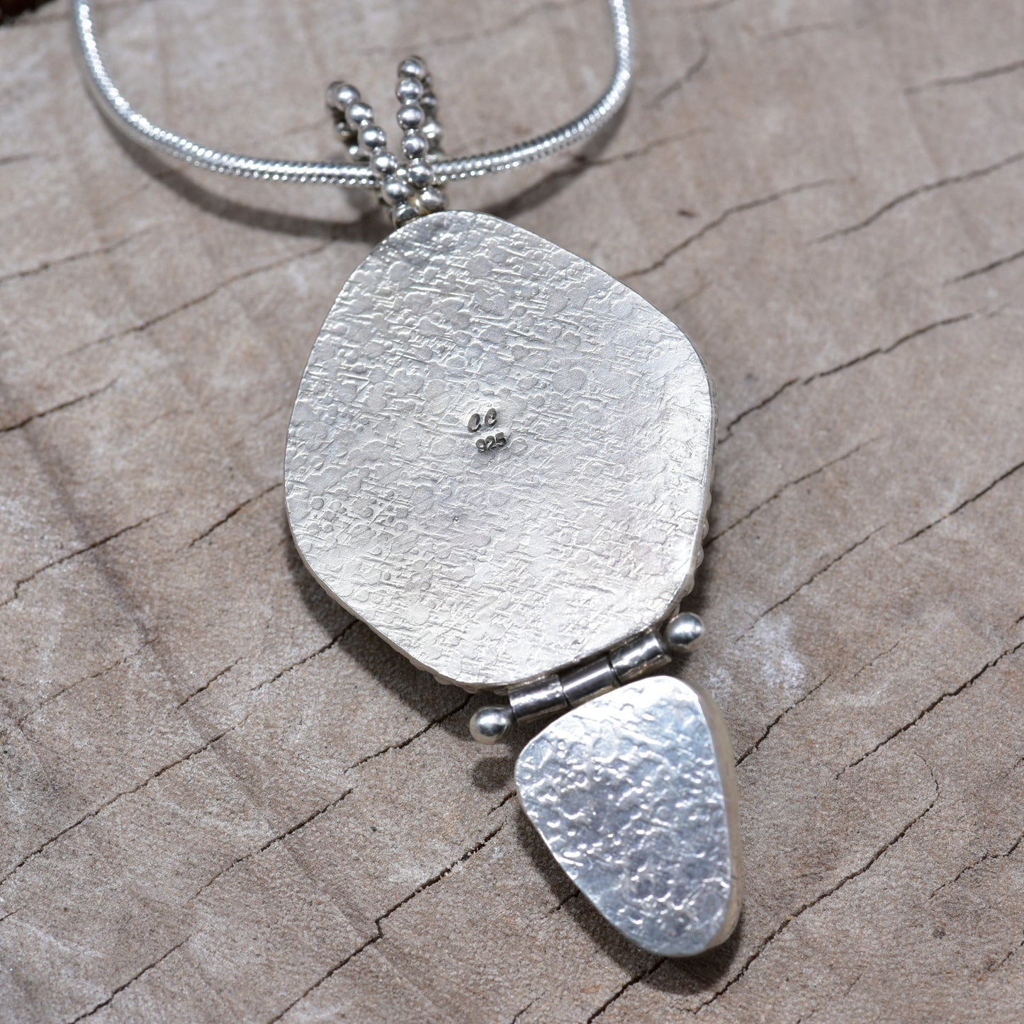 Sea glass and stone pendant necklace in a hand crafted setting of sterling silver. (N831)