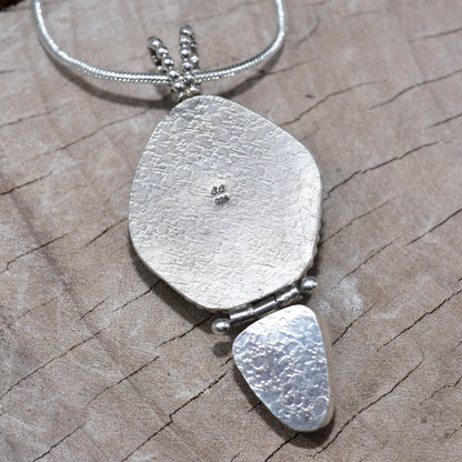Sea glass and stone pendant necklace in a hand crafted setting of sterling silver. (N831)
