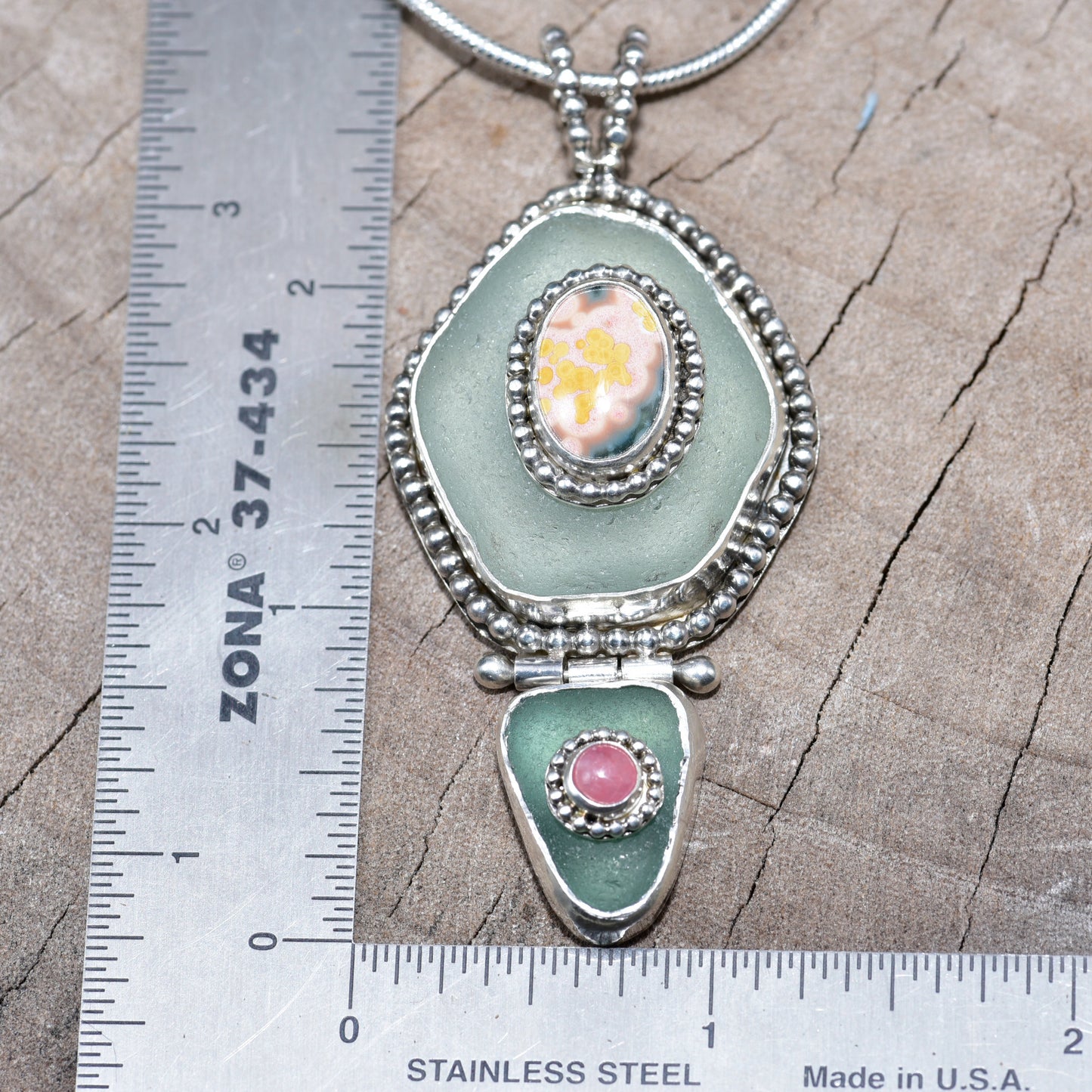 Sea glass and stone pendant necklace in a hand crafted setting of sterling silver. (N831)