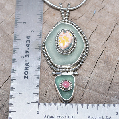 Sea glass and stone pendant necklace in a hand crafted setting of sterling silver. (N831)