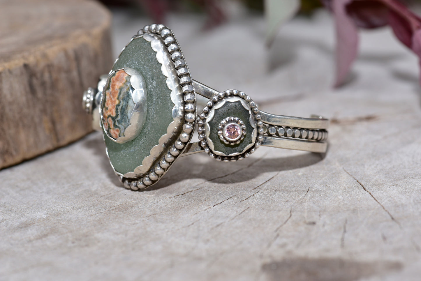 Sea glass and stone cuff bracelet in a hand crafted setting of sterling silver. (B832)