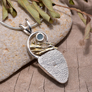 Sea glass and gemstone pendant necklace in a handcrafted setting of sterling silver. (N841)