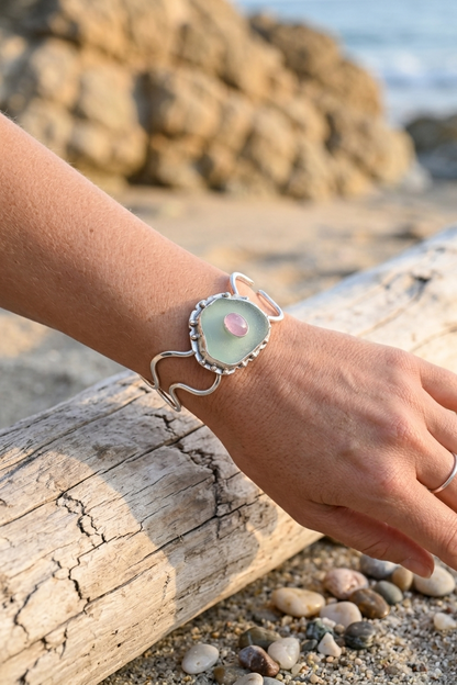 Close up of woman's wrist wearing sea glass bracelet