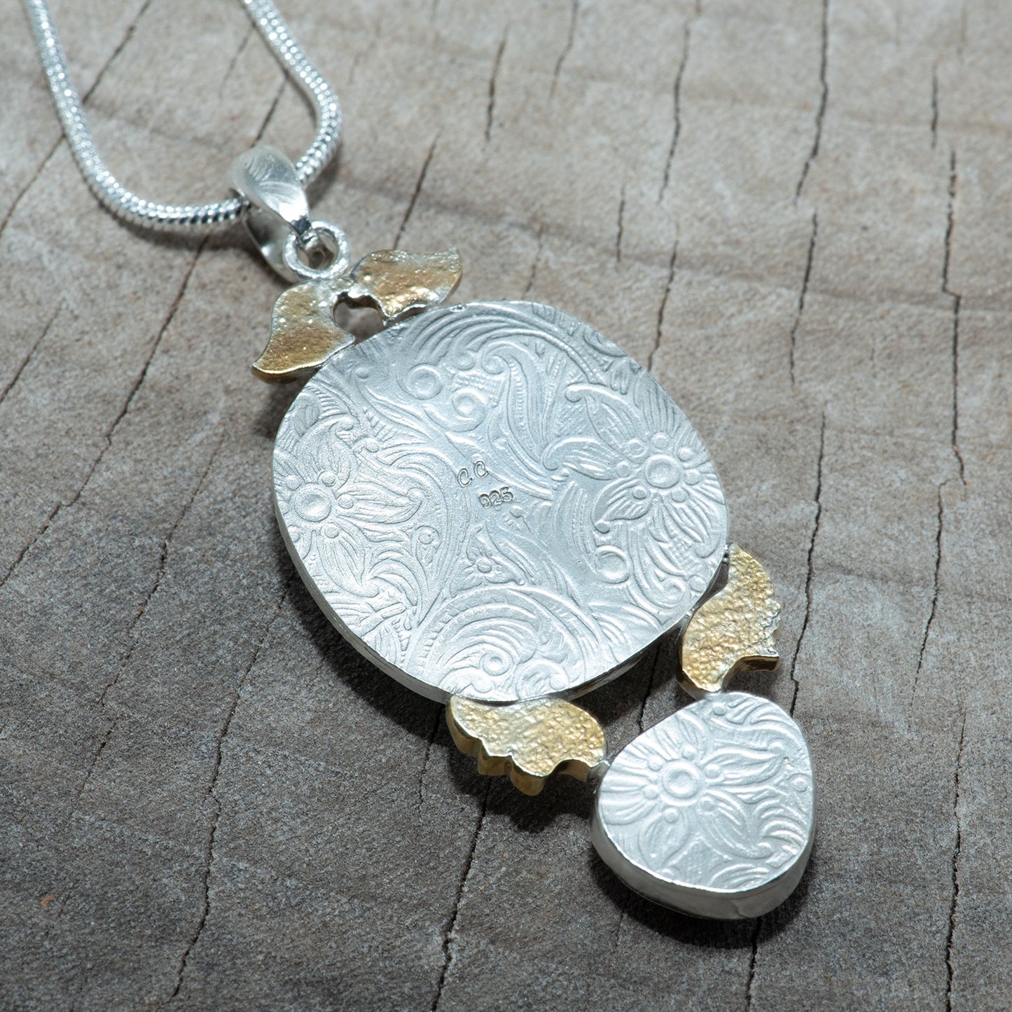 Fused dichoric glass pendant in a hand crafted setting of sterling silver (N863)