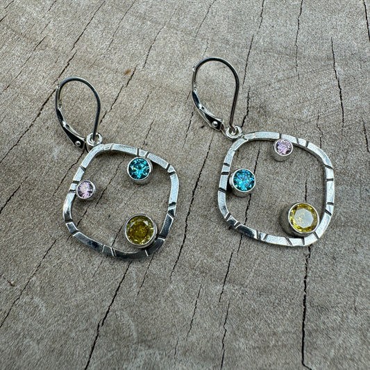 Sparkly multicolor cubic zirconia earrings in handcrafted settings of sterling silver. (E869)