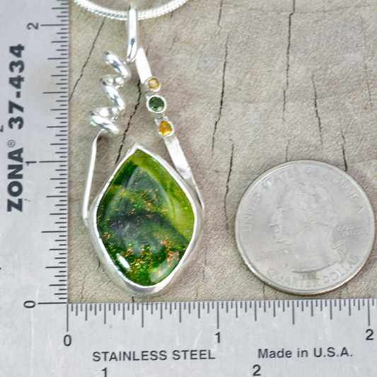 Fused dichroic glass pendant in a handmade setting of sterling silver accented with sparkly cubic zirconias. (N876)