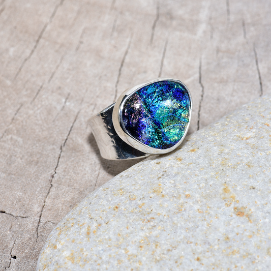 Artisan ring with a fused glass cabochon in a hand crafted setting of tarnish resistant sterling silver. (R903)