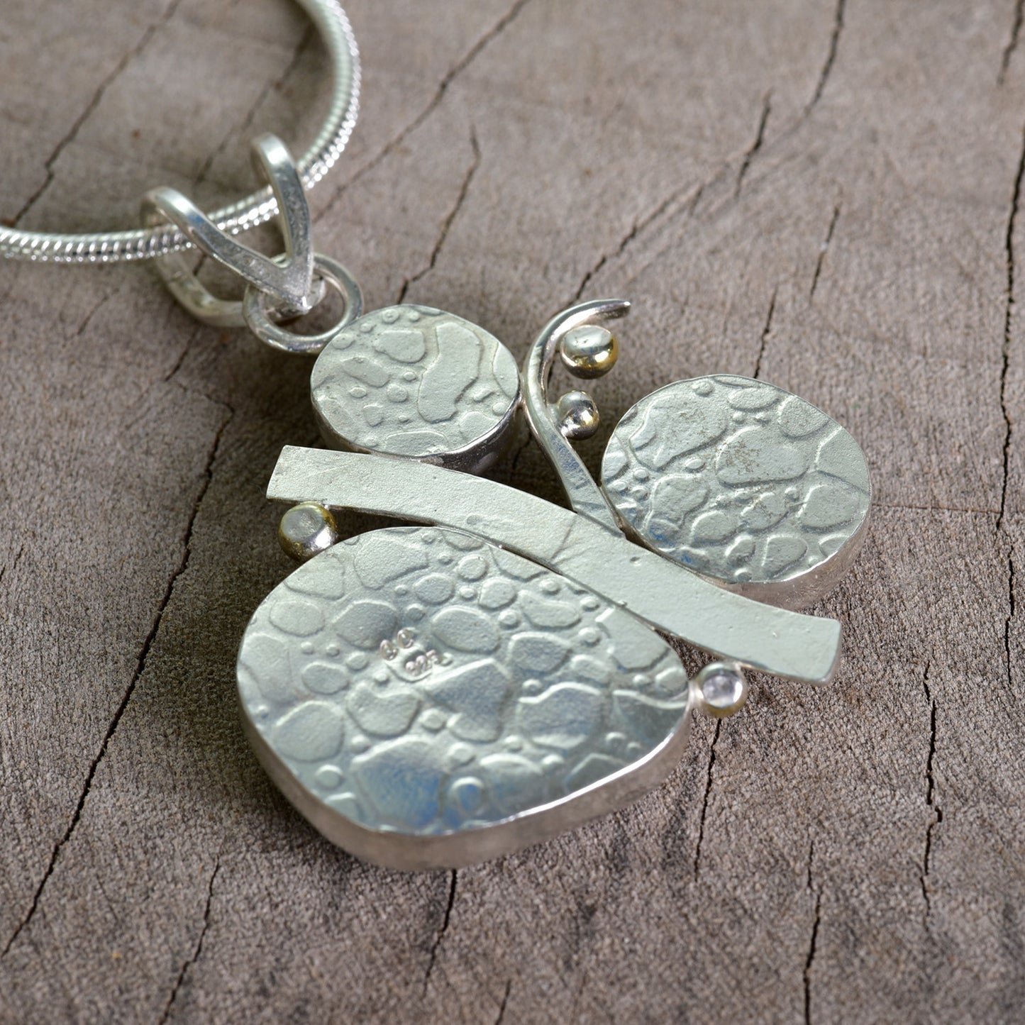 Fused dichroic glass necklace in a hand crafted setting of sterling silver accented with gold (N927)