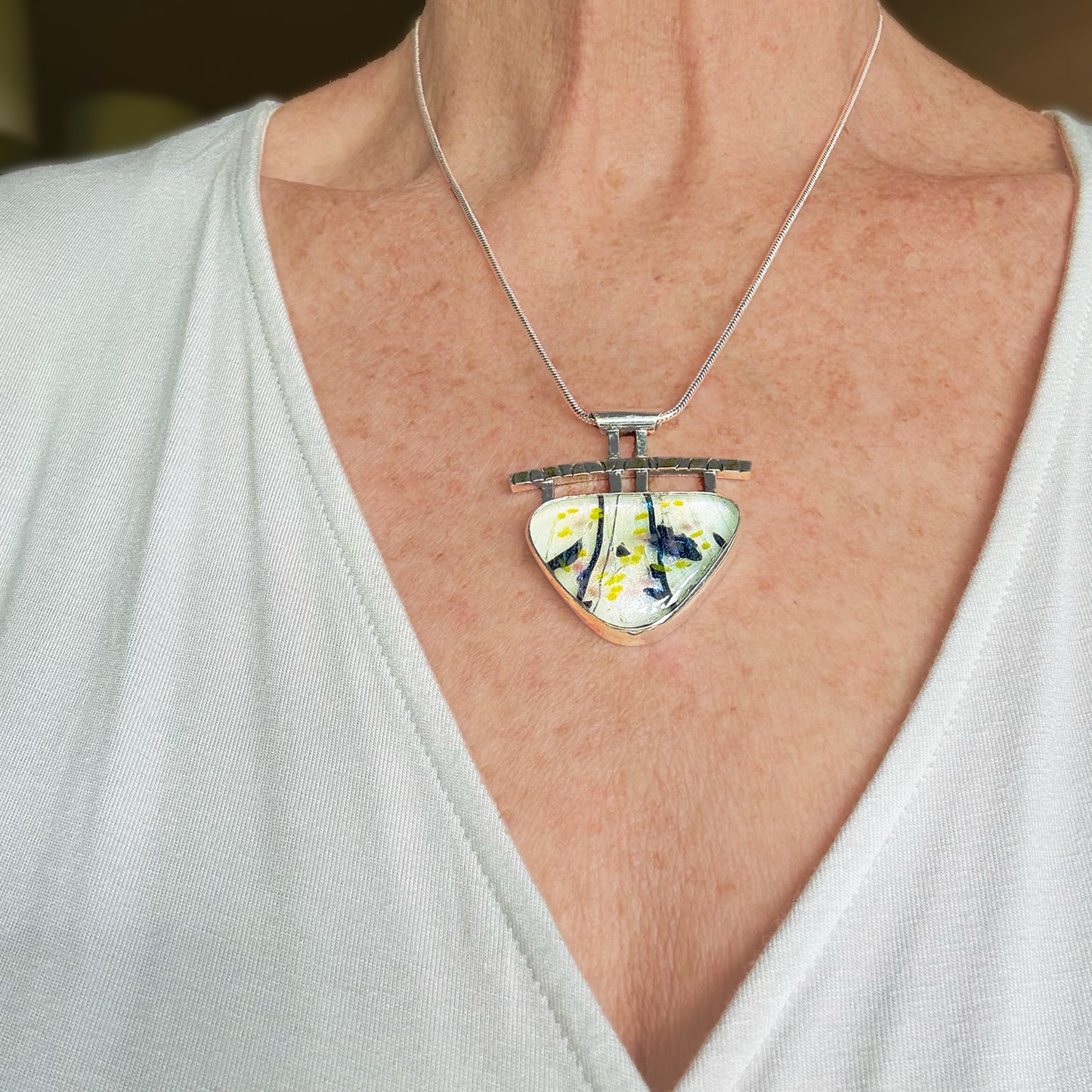 Artistic fused dichroic glass necklace in a hand crafted setting of sterling silver accented with gold (N930)