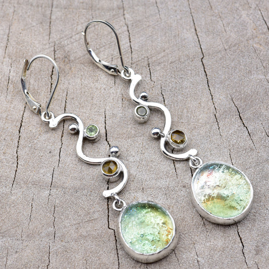 Pair of seafoam green and gold dichroic fused glass dangle earrings in hand-formed Argentium sterling silver waves with peridot and citrine accents