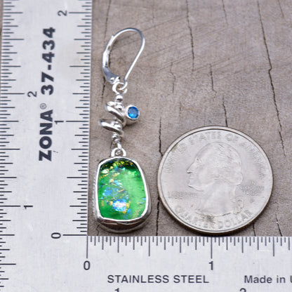 One earring beside a ruler and a quarter, measuring about 1 3/4 inches from the top of the ear wire to the bottom of the glass