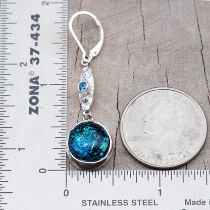 One earring beside a ruler and a quarter, measuring about 1 7/8 inches from the top of the ear wire to the bottom of the glass