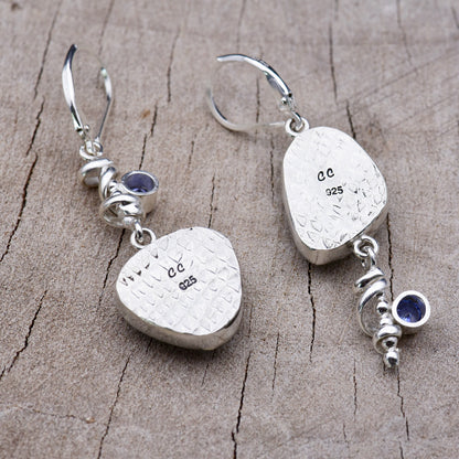 Back of the sterling silver earrings showing the diamond-patterned embossed bezel backs stamped with the CC maker's mark and 925 hallmark