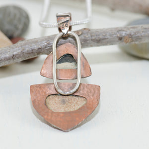 Mixed metal pendant crafted with vintage sea pottery in an setting of copper and sterling silver. (N149)