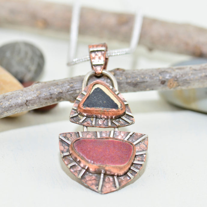 Mixed metal pendant crafted with vintage sea pottery in an setting of copper and sterling silver. (N149)