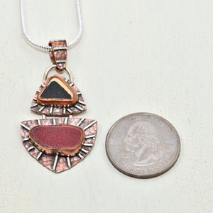 Mixed metal pendant crafted with vintage sea pottery in an setting of copper and sterling silver. (N149)