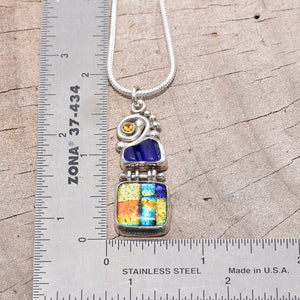 Pendant necklace crafted from dichroic glass and sea glass accented with sparkly CZs in a setting of fine and sterling silver. (N198)