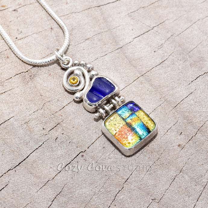 Pendant necklace crafted from dichroic glass and sea glass accented with sparkly CZs in a setting of fine and sterling silver. (N198)