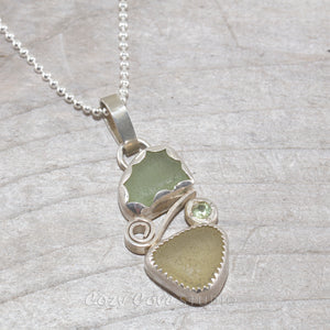 Two piece soft green and yellow sea glass pendant accented with a sparkly peridot in sterling silver. (N386)