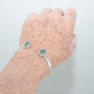 Sea glass cuff bracelet in a hand made sterling silver setting. (B399)