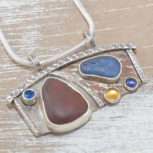 Sea glass pendant necklace in mixed metals of sterling silver and copper. (N431)