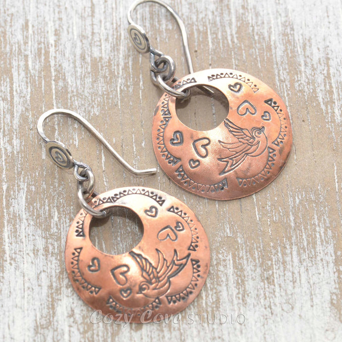 Whimsical handstamped mixed metal earrings of sterling silver and copper.