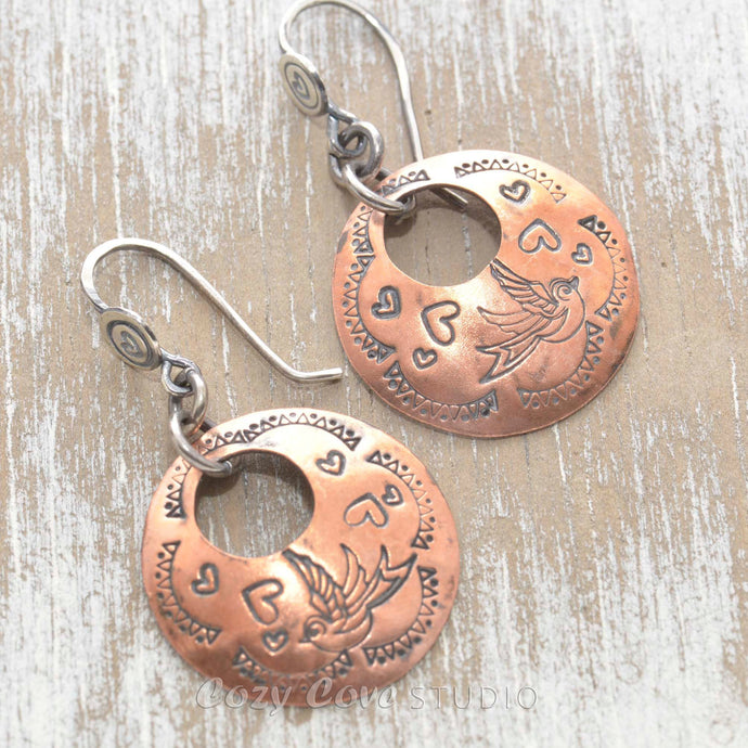 Whimsical handstamped mixed metal earrings of sterling silver and copper.