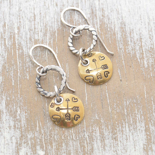 Whimsical handstamped mixed metal earrings of sterling silver and brass.