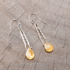 Handmade trapeze earrings with  semi-precious citrine briolettes suspended by sterling silver rivets. (E464)