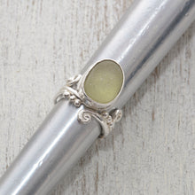 Load image into Gallery viewer, Green sea glass ring in sterling silver on ring stick
