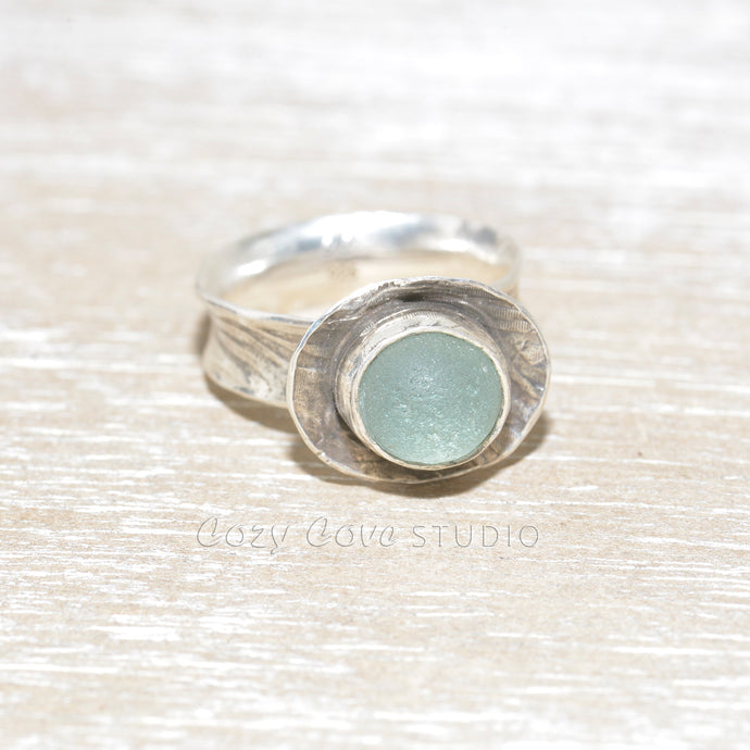 Sea glass statement ring with pale blue sea glass in a handmade setting of sterling silver. (R509)