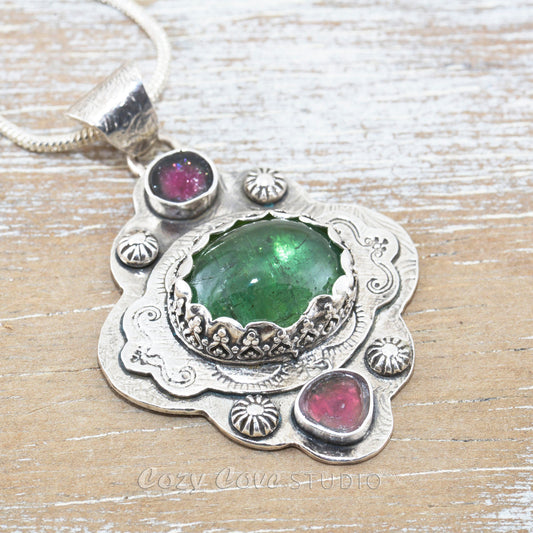 Boho style pendant necklace with a large green tourmaline in  hand crafted sterling silver setting accented with watermelon tourmaline slices. (N513)