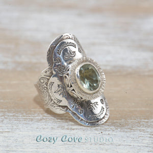 Boho style ring with a sparkly green topaz in a hand crafted setting of sterling silver. (R515)