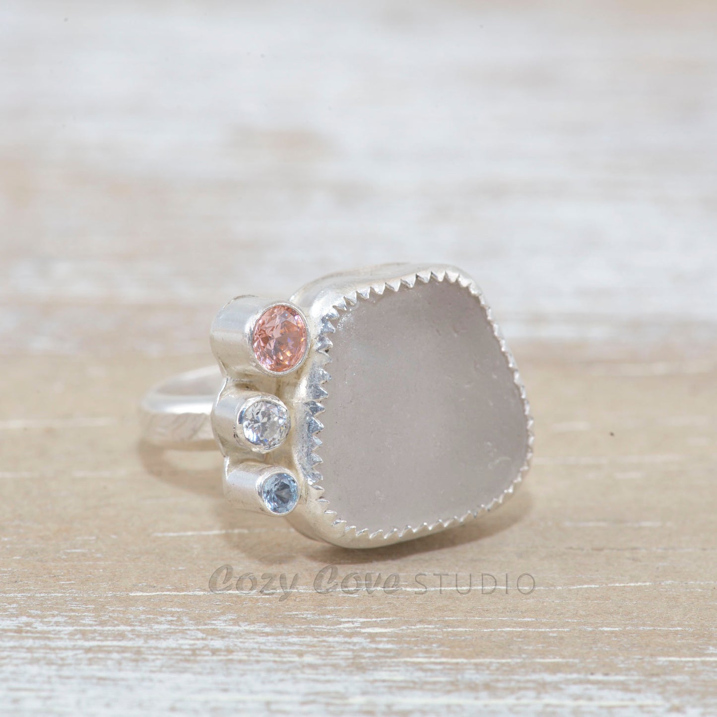 Sea glass ring with accented with sparkly cubic zirconias  in sterling silver. (R531)
