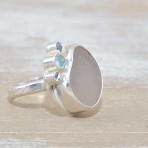 Sea glass ring  accented with an aquamarine and sparkly cubic zirconias  in sterling silver. (R533)