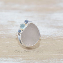 Load image into Gallery viewer, Sea glass ring  accented with an aquamarine and sparkly cubic zirconias  in sterling silver. (R533)
