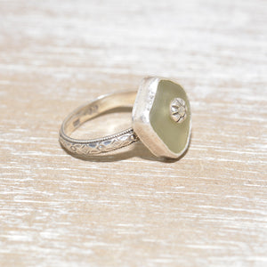Sea glass ring with a hand crafted stud in a setting of fine and sterling silver. (R559)