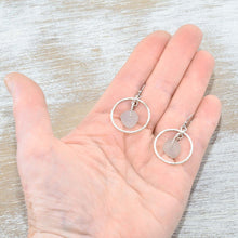 Load image into Gallery viewer, Pale lavender sea glass earrings encircled by textured hoops of sterling silver. (E587)
