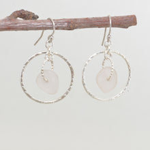 Load image into Gallery viewer, Pale lavender sea glass earrings encircled by textured hoops of sterling silver. (E587)
