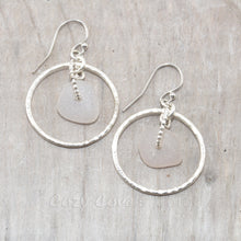 Load image into Gallery viewer, Pale lavender sea glass earrings encircled by textured hoops of sterling silver.

