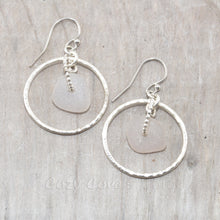 Load image into Gallery viewer, Pale lavender sea glass earrings encircled by textured hoops of sterling silver.
