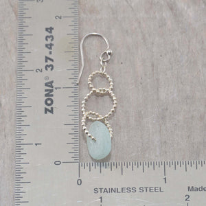 Sea glass dangle earrings on circle of sterling silver beaded wire. (E593)